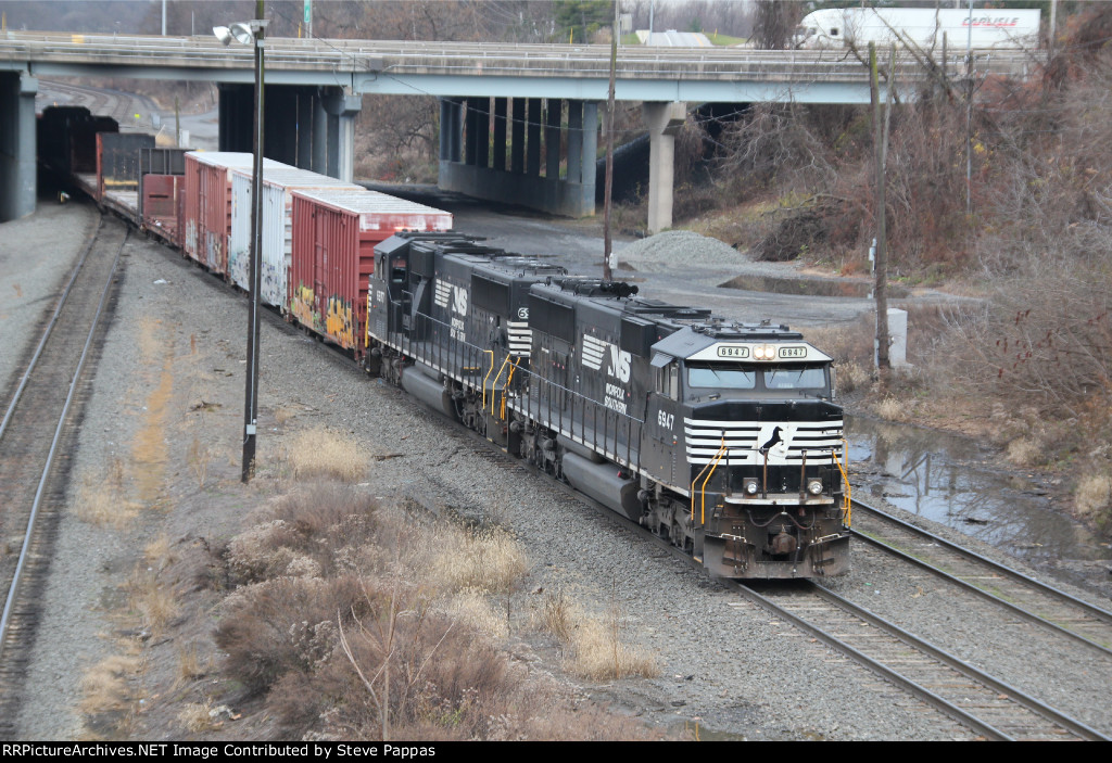 NS 6947 leads a train out of Enola yard